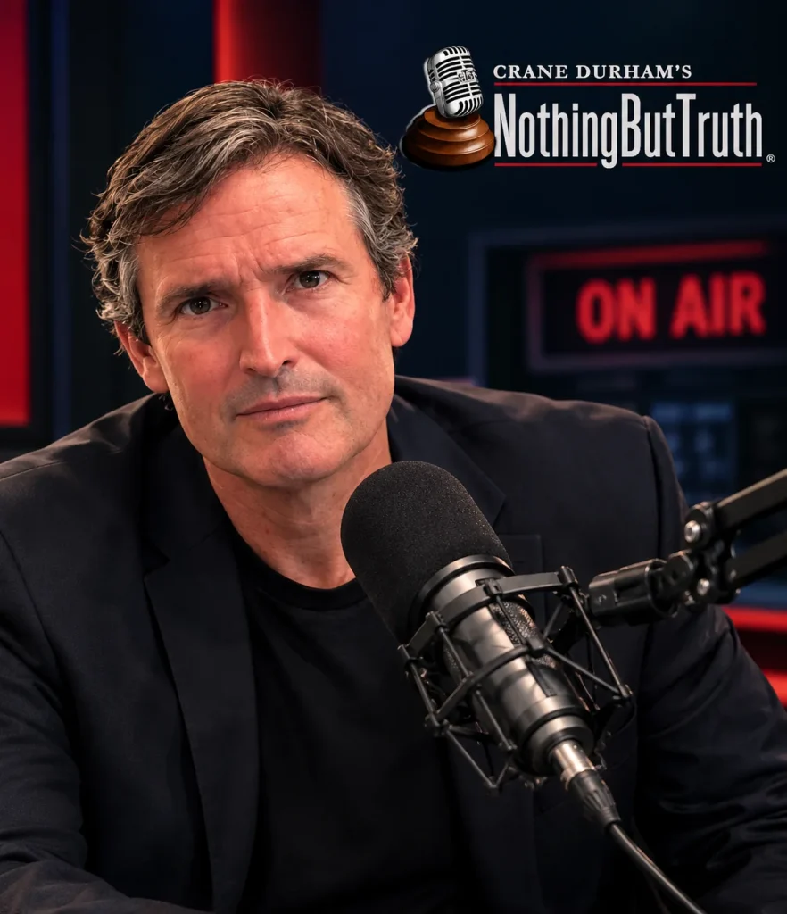 Crane Durham at the microphone in the Nothing But Truth studio, On Air sign behind him